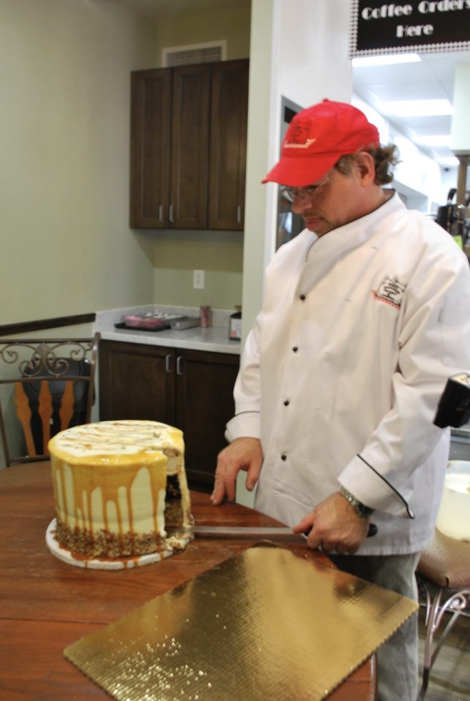 Bobby Jucker with the first Pumpecapple Piecake. Photo courtesy of Three Brothers Bakery