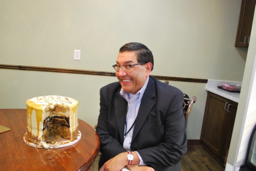 Greg Morago, Food Editor Houston Chronicle, admires the cake that came from his idea - the Pumpecapple Piecake